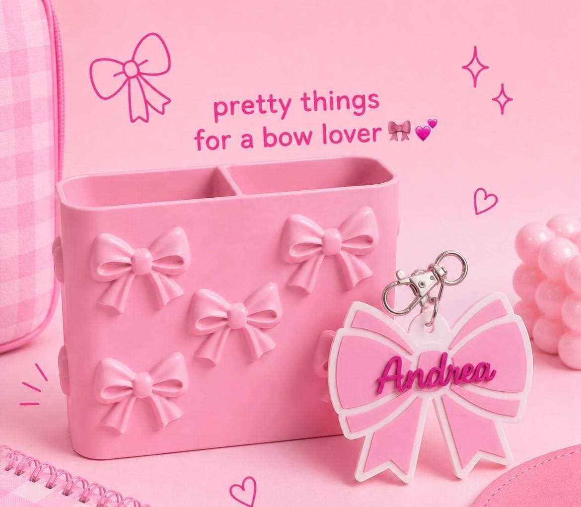 A pink bow keychain personalized with a guest's name